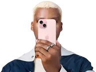 Person holding iPhone 15 in front of his face to conceal identity